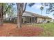 Backyard with a screened lanai provides an ideal setting for outdoor living and entertaining at 100 Honeywood Ct, Kissimmee, FL 34743