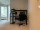 Hallway view of office, with a desk, chair, and view to another bedroom at 1013 Flowing Tide Dr, Orlando, FL 32828