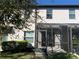 This is a back exterior view of the home showcasing a screened porch at 1013 Flowing Tide Dr, Orlando, FL 32828