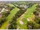 Golf course aerial with sand traps; lush, green landscape perfect for outdoor recreation at 112 E Cumberland Cir, Longwood, FL 32779