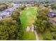 A beautiful aerial view of a lush golf course with residences and green space at 112 E Cumberland Cir, Longwood, FL 32779