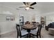 Cozy dining area with ceiling fan and views of the kitchen and living spaces in this well-lit, neutral-toned home at 112 E Cumberland Cir, Longwood, FL 32779