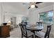 Bright dining area featuring a modern table setting and clear sightlines to the adjacent living space at 112 E Cumberland Cir, Longwood, FL 32779