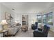 Inviting living room with plush seating, a neutral color scheme, and ample natural light at 112 E Cumberland Cir, Longwood, FL 32779