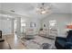 Inviting living room with neutral colors, a ceiling fan, and comfortable seating, perfect for relaxation at 112 E Cumberland Cir, Longwood, FL 32779