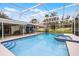 Relaxing screened-in pool with integrated spa and ample seating area, perfect for outdoor entertaining and leisure at 112 E Cumberland Cir, Longwood, FL 32779