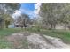 A spacious backyard with scattered trees, offering ample space for outdoor activities at 1129 Ne 12Th St, Ocala, FL 34470