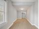 Hallway featuring a window, a ceiling light, and light wood-look flooring at 1129 Ne 12Th St, Ocala, FL 34470