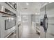 Kitchen area featuring stainless steel appliances and a view of the dining and living area at 1129 Ne 12Th St, Ocala, FL 34470