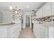 Modern kitchen featuring stainless steel appliances, white cabinets, and tile backsplash at 1129 Ne 12Th St, Ocala, FL 34470