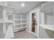 Pantry with white shelving and good lighting at 1129 Ne 12Th St, Ocala, FL 34470