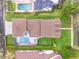 An aerial view showing the entire property, including the pool, landscaping, and the roof at 11402 Camden Loop Way, Windermere, FL 34786