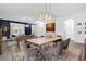 Bright dining area with modern light fixture and comfortable seating at 11402 Camden Loop Way, Windermere, FL 34786