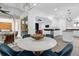 Stylish dining area with views to the outdoor living space and modern kitchen at 11402 Camden Loop Way, Windermere, FL 34786