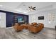 Beautiful living room with wood-look tile flooring, modern furniture and ceiling fan at 11402 Camden Loop Way, Windermere, FL 34786