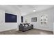 Cozy living room with a comfortable gray couch and large window for natural light at 11402 Camden Loop Way, Windermere, FL 34786