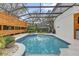 Inviting pool with a screened enclosure for enjoying the outdoors year-round at 11402 Camden Loop Way, Windermere, FL 34786