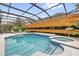 Beautiful private pool area featuring a hot tub and screen enclosure at 11402 Camden Loop Way, Windermere, FL 34786