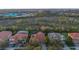 Birds eye view of a neighborhood featuring tiled roofs and lush landscaping at 11733 Delwick Dr, Windermere, FL 34786