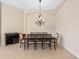 Formal dining room with modern chandelier and table with seating for eight at 11733 Delwick Dr, Windermere, FL 34786