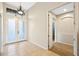 Bright foyer featuring tile flooring, double front doors, decorative light fixture, and an open doorway to another room at 11733 Delwick Dr, Windermere, FL 34786