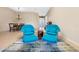 Living room featuring tile flooring, and stylish blue seating at 11733 Delwick Dr, Windermere, FL 34786