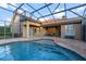 A beautiful in-ground swimming pool with a large screened enclosure at 11733 Delwick Dr, Windermere, FL 34786