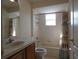 Full bathroom with a bathtub and shower, a window providing natural light, and vanity at 1230 Elegance Ct, Orlando, FL 32828