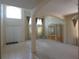 Spacious living room featuring tile flooring near the entryway and an elegant display case at 1230 Elegance Ct, Orlando, FL 32828