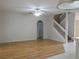 Living room with hardwood floors and staircase to second floor at 1230 Elegance Ct, Orlando, FL 32828