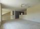 Spacious loft area with carpet, offering a flexible and open space for recreation or relaxation at 1230 Elegance Ct, Orlando, FL 32828