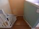 Stairway featuring wood stairs, white railing, and colorful walls, creating an inviting transition between floors at 1230 Elegance Ct, Orlando, FL 32828