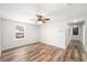 Bedroom with a window letting in lots of light and wood floors at 1317 Independence Ln, Mount Dora, FL 32757