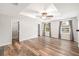 Spacious bedroom with wood-look floors, a ceiling fan, and two closets at 1317 Independence Ln, Mount Dora, FL 32757