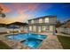 Exterior rear of home features a pool, jacuzzi, and white fencing at 1317 Independence Ln, Mount Dora, FL 32757