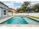 Backyard pool and spa with umbrella in paver patio at 1317 Independence Ln, Mount Dora, FL 32757