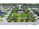 Aerial view of a community pool and surrounding landscaped park at 1714 Leatherback Ln, St Cloud, FL 34771