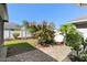 Manicured backyard featuring a brick patio, lush greenery, and mature trees for added privacy at 1714 Leatherback Ln, St Cloud, FL 34771