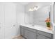 Neutral bathroom with a wide mirror, modern vanity, and a clean, well-lit atmosphere at 1714 Leatherback Ln, St Cloud, FL 34771