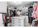 Spacious walk-in closet with custom shelving for optimal organization and storage at 1714 Leatherback Ln, St Cloud, FL 34771