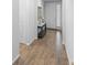 Hallway featuring wood-look tile flooring and an interior view of a front door at 1714 Leatherback Ln, St Cloud, FL 34771