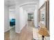 Hallway featuring wood-look tile flooring leading into open-concept living spaces at 1714 Leatherback Ln, St Cloud, FL 34771