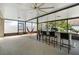 Bright screened-in porch boasts an outdoor bar area, a relaxing hammock, and ceiling fans at 1714 Leatherback Ln, St Cloud, FL 34771