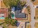 Aerial view of house with pool and large yard surrounded by mature trees in neighborhood at 172 Post And Rail Rd, Longwood, FL 32750