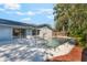 A private backyard featuring a sparkling inground pool and concrete deck at 172 Post And Rail Rd, Longwood, FL 32750