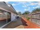 Fenced backyard featuring a cozy gravel area and sliding glass door to the home's interior at 172 Post And Rail Rd, Longwood, FL 32750