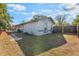 A cozy backyard featuring a well-maintained lawn and a classic wooden fence for privacy at 172 Post And Rail Rd, Longwood, FL 32750