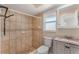 Bathroom features tile flooring, a tiled shower, vanity with marble top, and a window for natural light at 172 Post And Rail Rd, Longwood, FL 32750