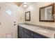 Bathroom featuring a double vanity, granite countertops, and two framed mirrors at 172 Post And Rail Rd, Longwood, FL 32750