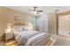 Inviting bedroom featuring a neutral color scheme, a ceiling fan, a comfortable bed, and ample storage at 172 Post And Rail Rd, Longwood, FL 32750